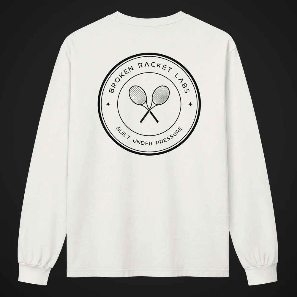 The Day Shift in vintage white, back view with the black Broken Racket Labs seal